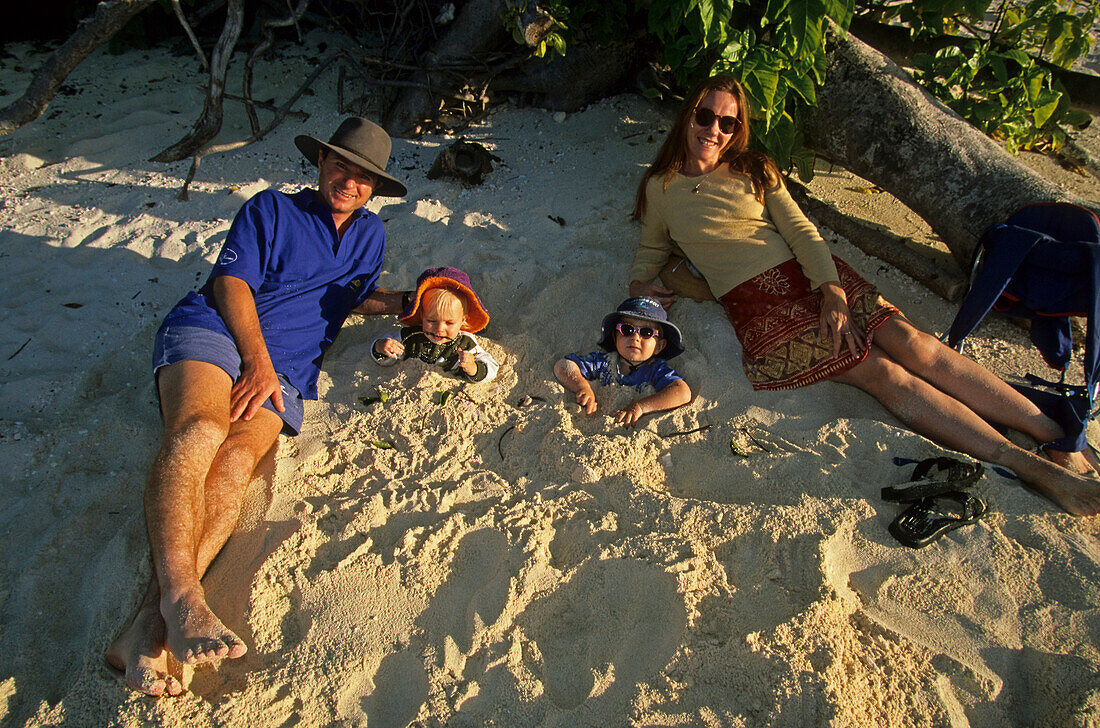 Family on beach, Heron Island, Great Barrier Reef, Queensland, Australiay