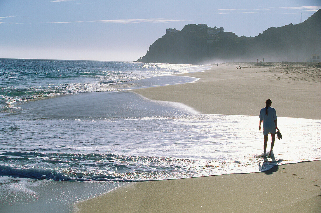 Woman strolling along the beach, Baja California, Mexico, America