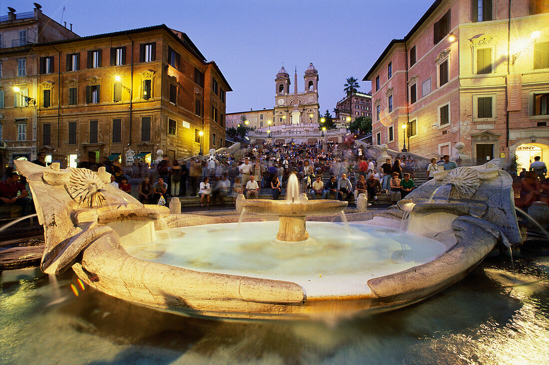 Spanish Steps with fountain and people at night, Rome, Italy