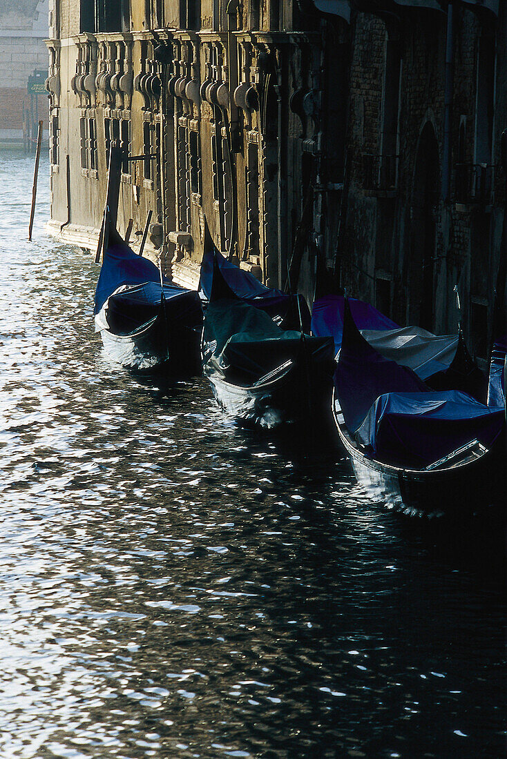 Gondolas at a canal at floodwater, Venice, Italy, Europe