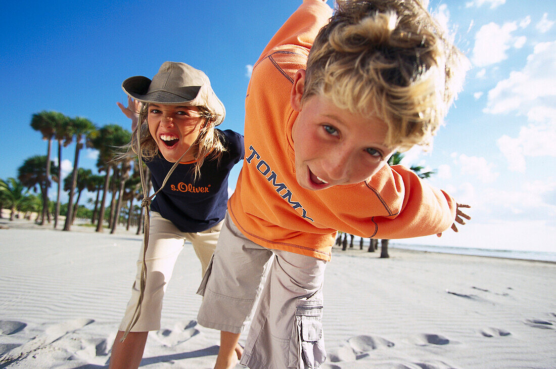 Boy&girl on the beach 10-11 years, , Miami, Florida, USA Children, People