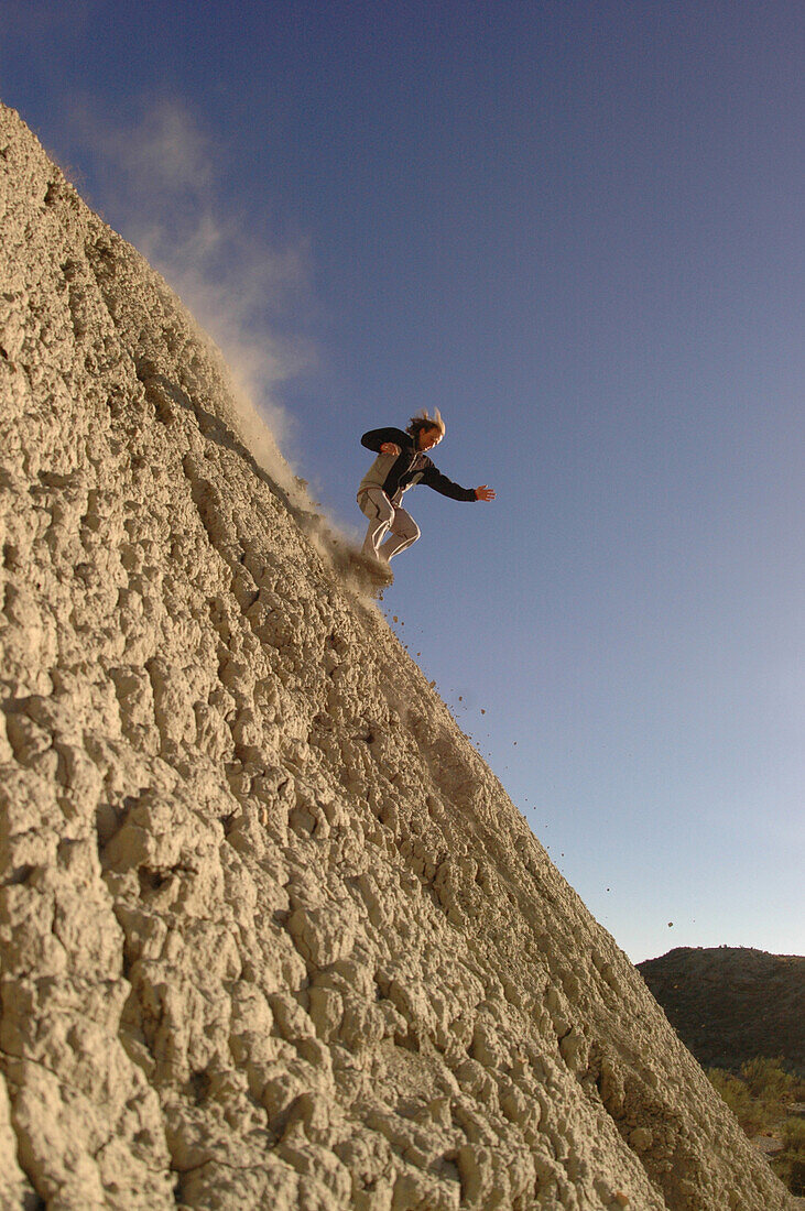 Man running downhill, Andalusia, Spain