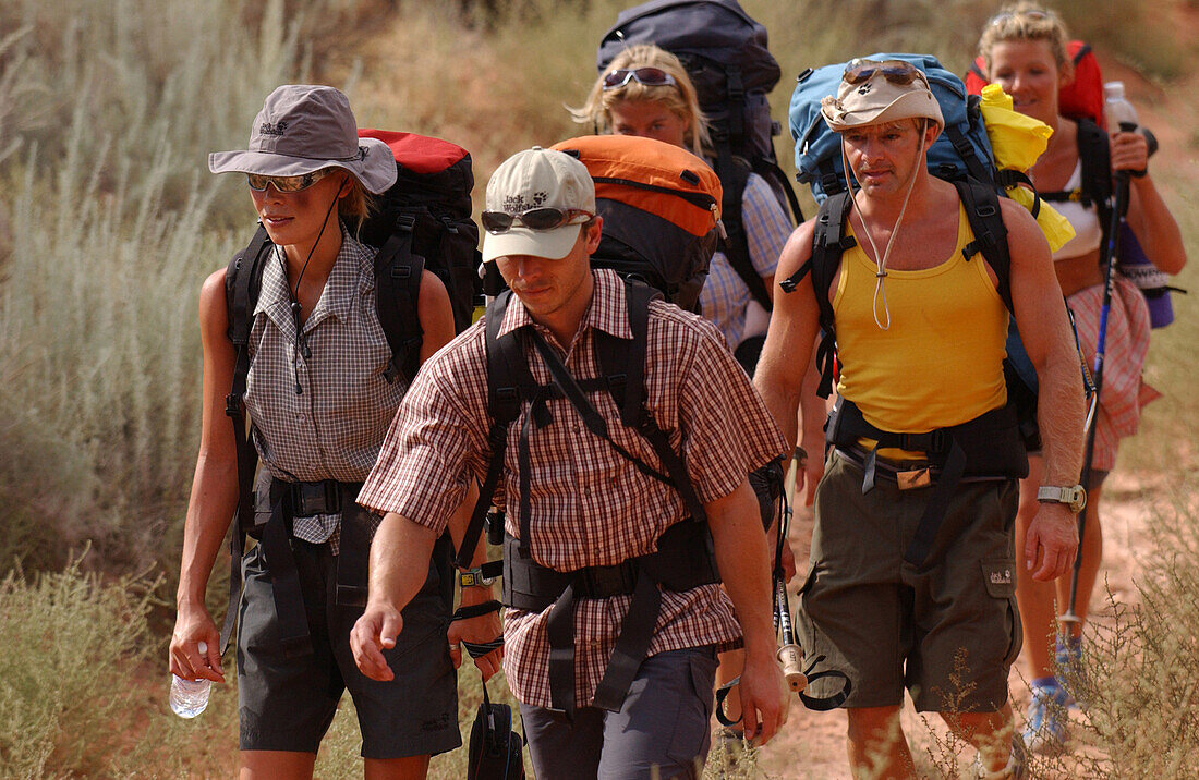 A group of people hiking at Lake Powell, Arizona, Utah, USA