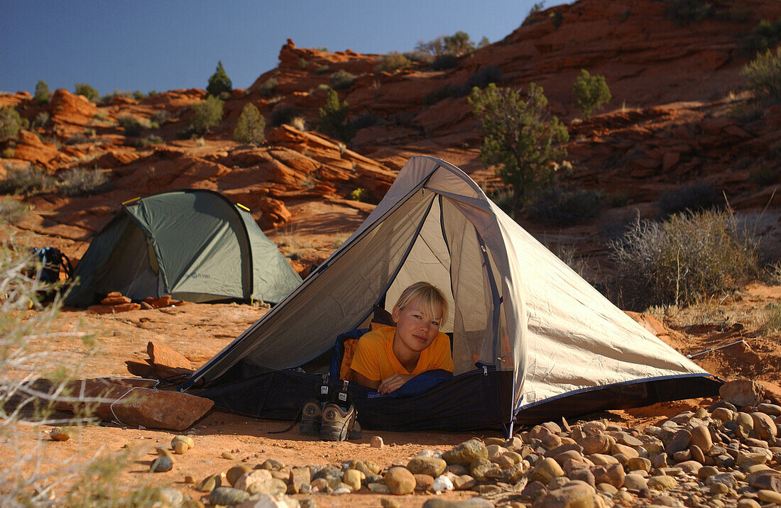 Woman camping at Lake Powell, Arizona, Utah, USA
