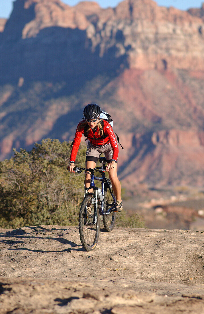 Woman on a mountainbike tour, Gooseberry Trail, Zion National Park, Springdale, Utah, USA