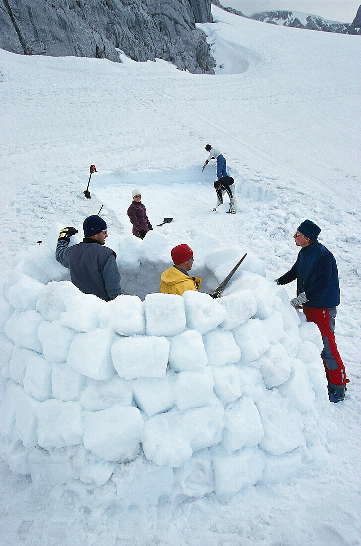 People building an igloo, Dachstein, Austria, Europe