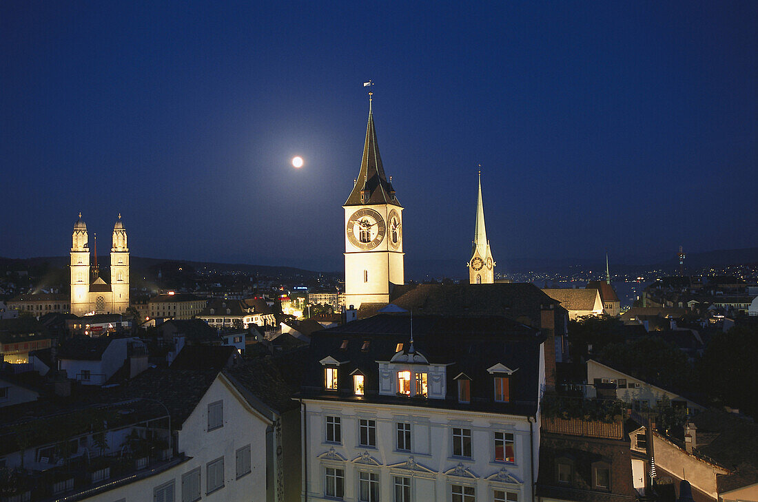 Old town with Grossmuenster, St. Peter church and Fraumuenster church at night, Zurich, Switzerland