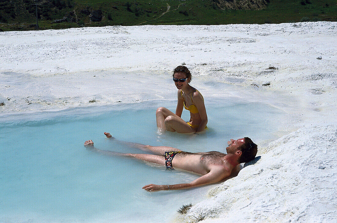 Tourists in natural Pool, Sinter Terraces of Pamukkale, Turkey