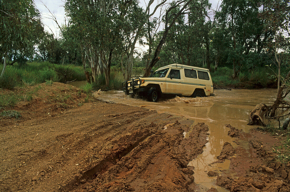 Four-wheel drive river crossing on the way to Mount Dare and the start of the Simpson Desert Crossing, Quensland, Australia