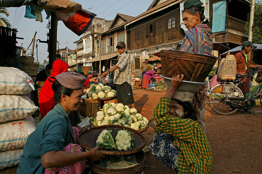 woman selling produce, Market day in Bago, Myanmar