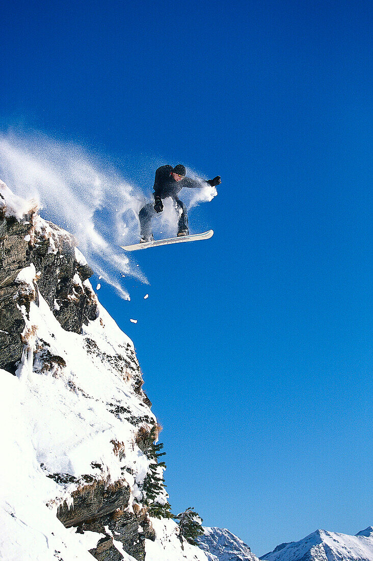 Snowboarding, Sprung ueber Felsen