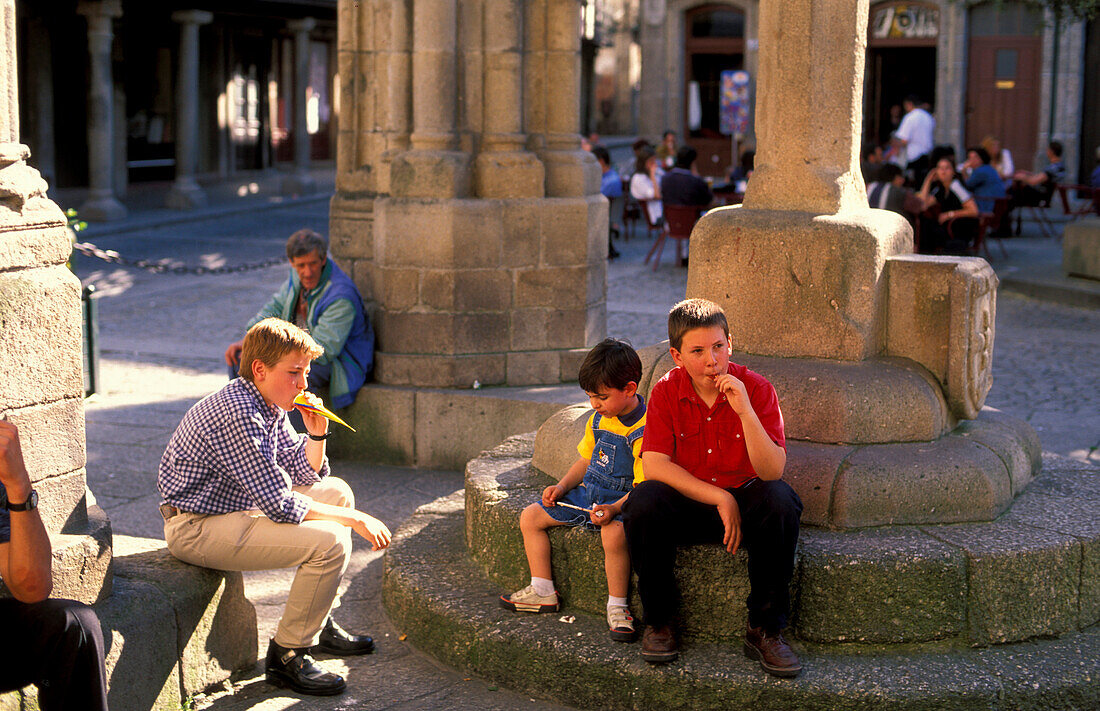 People at Largo de Oliveira, Padrao de Batalha do Salado, Guimaraees, Portugal