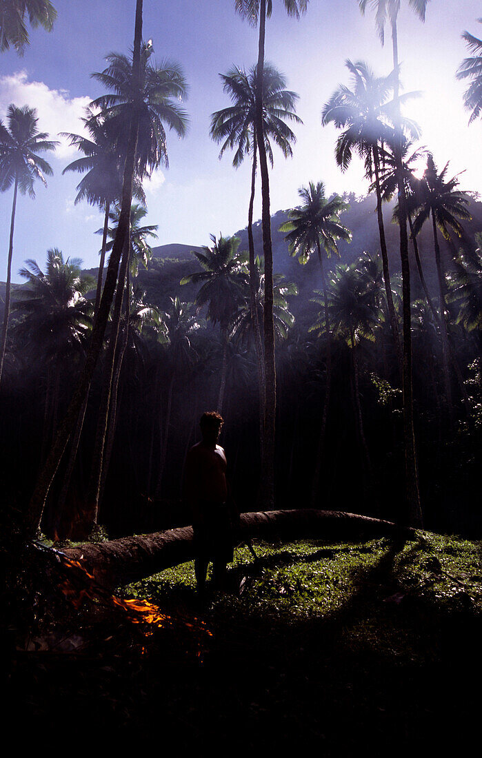 Worker on a coconut plantation, Ua Huka, Marquesas, Polynesia