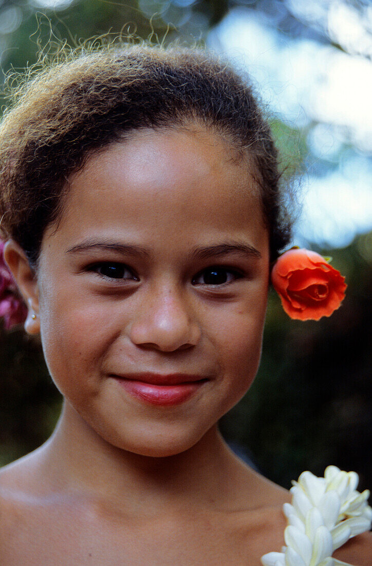 Portrait of a young girl with a flower in her hair, dancer, Ua Huka, Marquesas French Polynesia, South Pacific