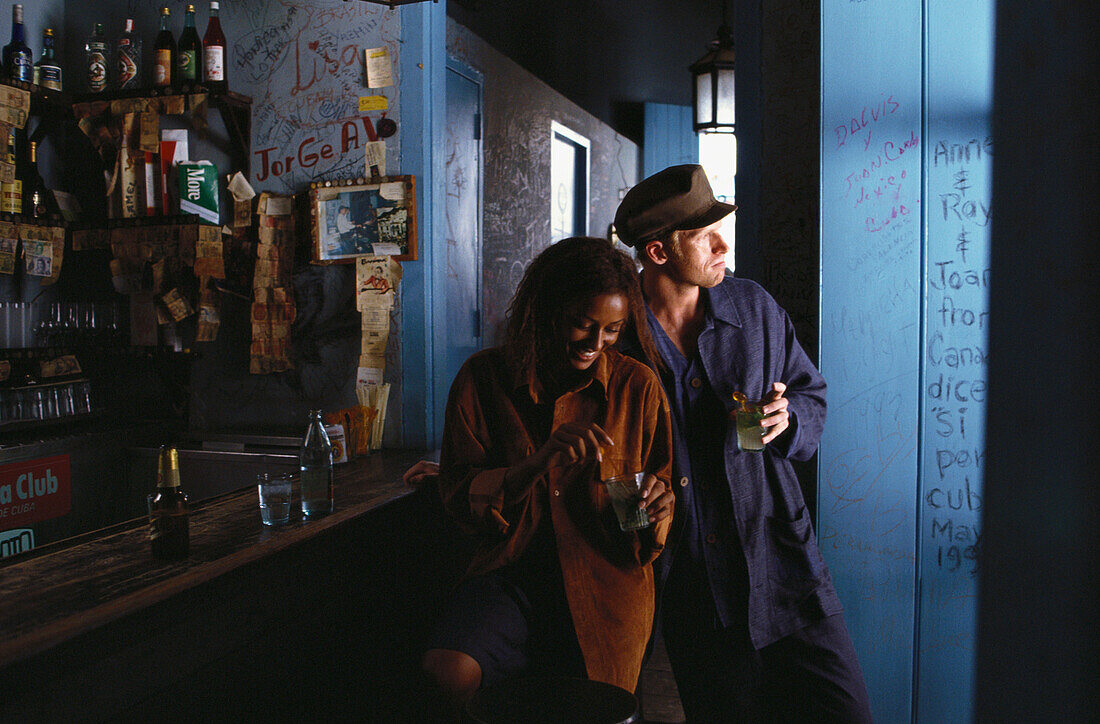 A man and a woman standing at the counter of a bar, Hemingway´s Bar, Bodeguita del Medio, Havana, Cuba