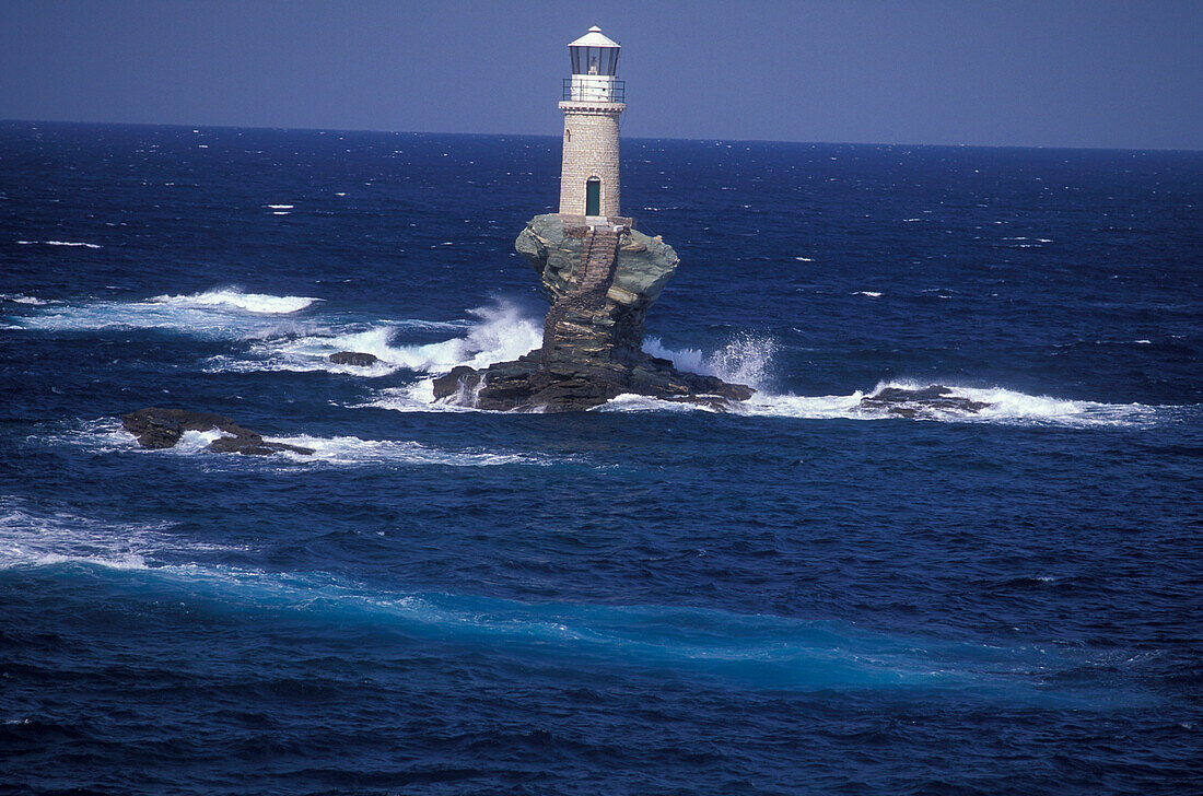 Lighthouse on little island, near Chora, Andros, Cyclades, South Aegean, Greece