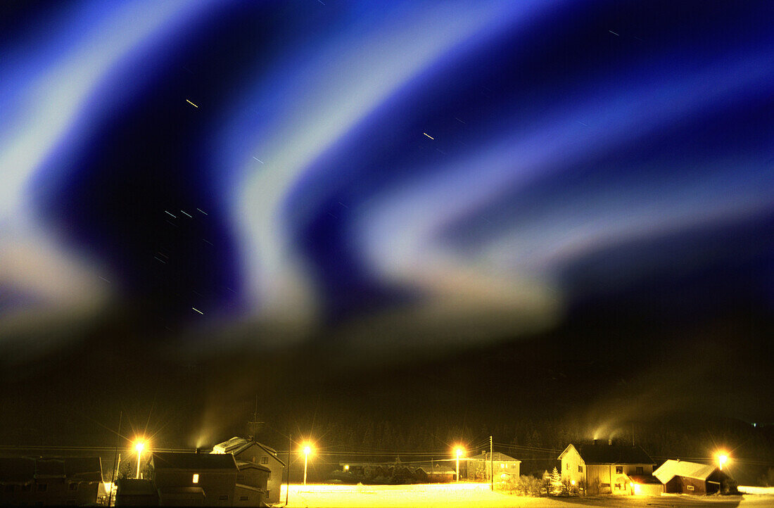 Aurora borealis over farm star traces due to eart, Hemsedal, Oppland Norway, Europe