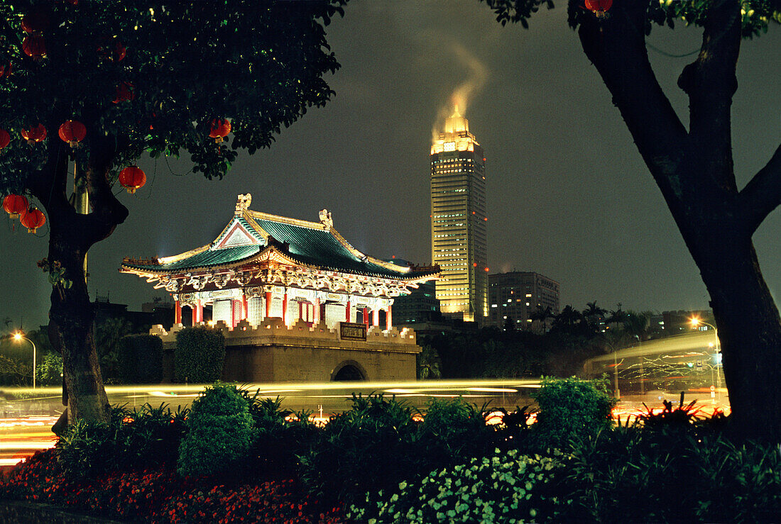 Old city gate and Mitsukoshi Tower at night, Taipei, Taiwan, Asia