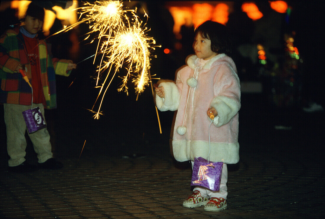 Yenshui fireworks festival, girl with firework, Yenshui, Tainan County Taiwan, Asia