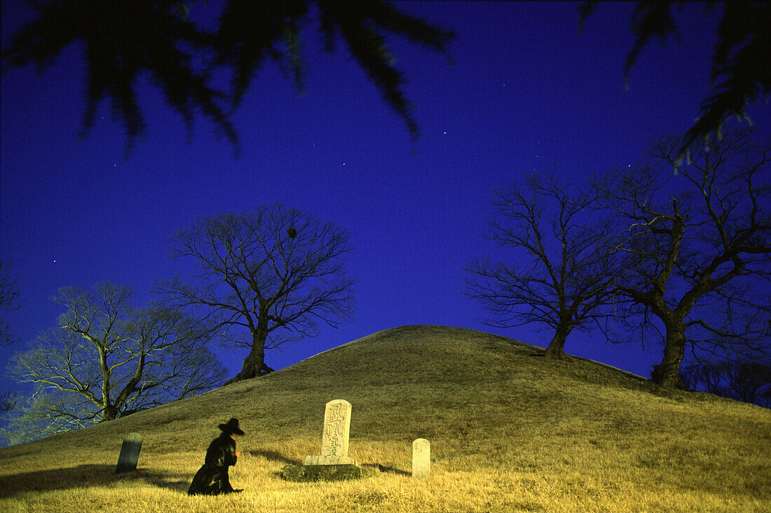 Confucian worshipping ancestors at grave mound, Gyeongj, South Korea, Asia