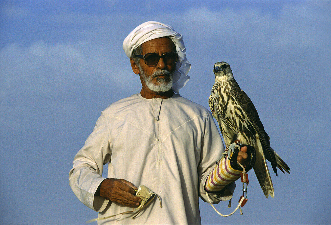 Falconer in the desert, Dubai, United Arab Emirates Middle East