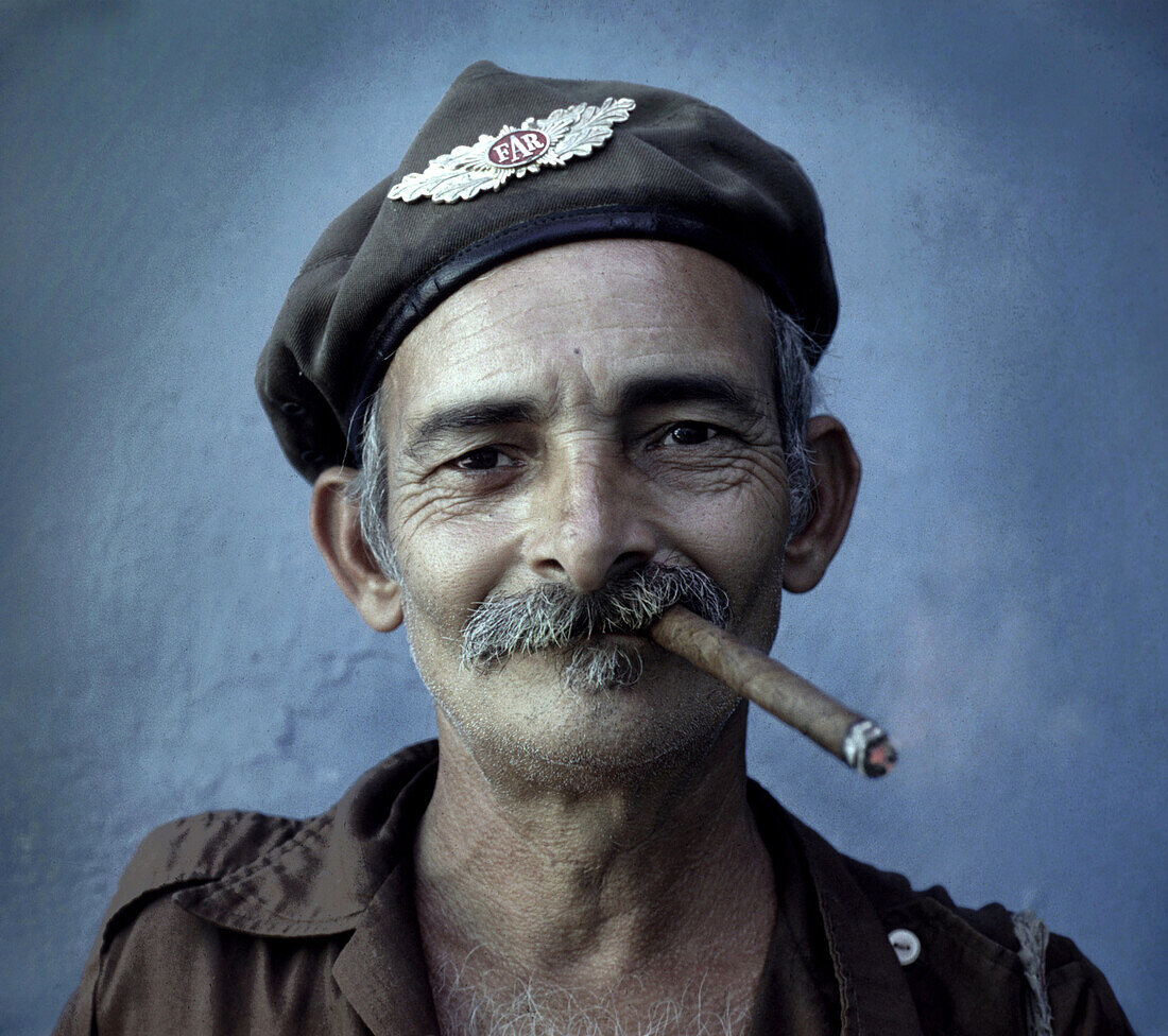 Revolutionist smoking cigar, Havana, Cuba