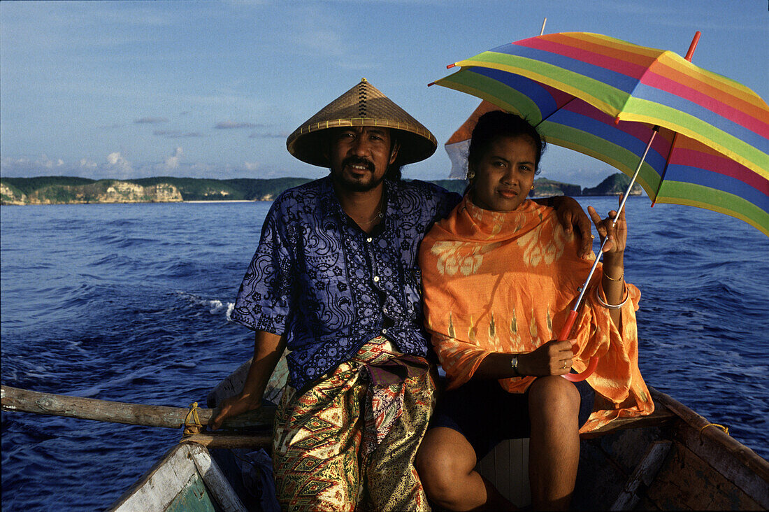 Couple on ferry boat, Lombok, Indonesia Asia