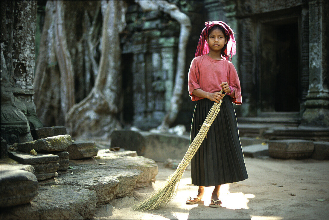 Sweeping Ta Prom temple, Angkor, Siem Raep Cambodia, Asia