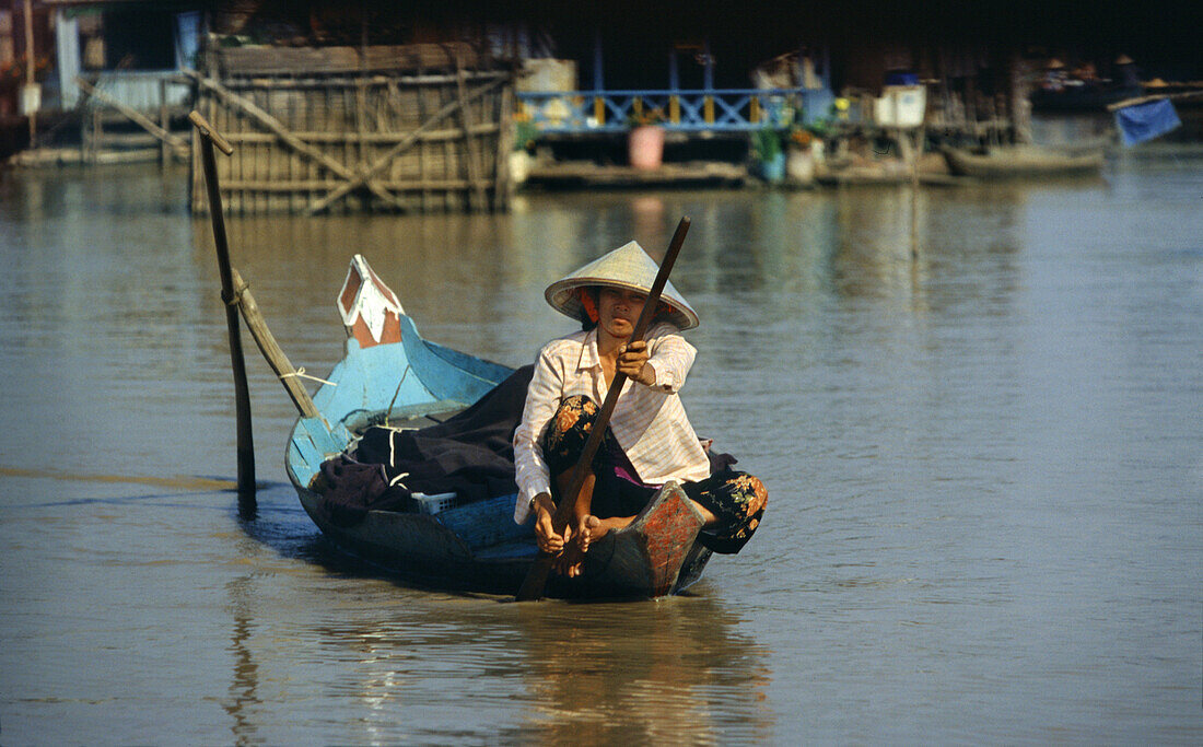 Woman in a boat on Tonle Sap lake, Siem Raep province, Cambodia, Asia