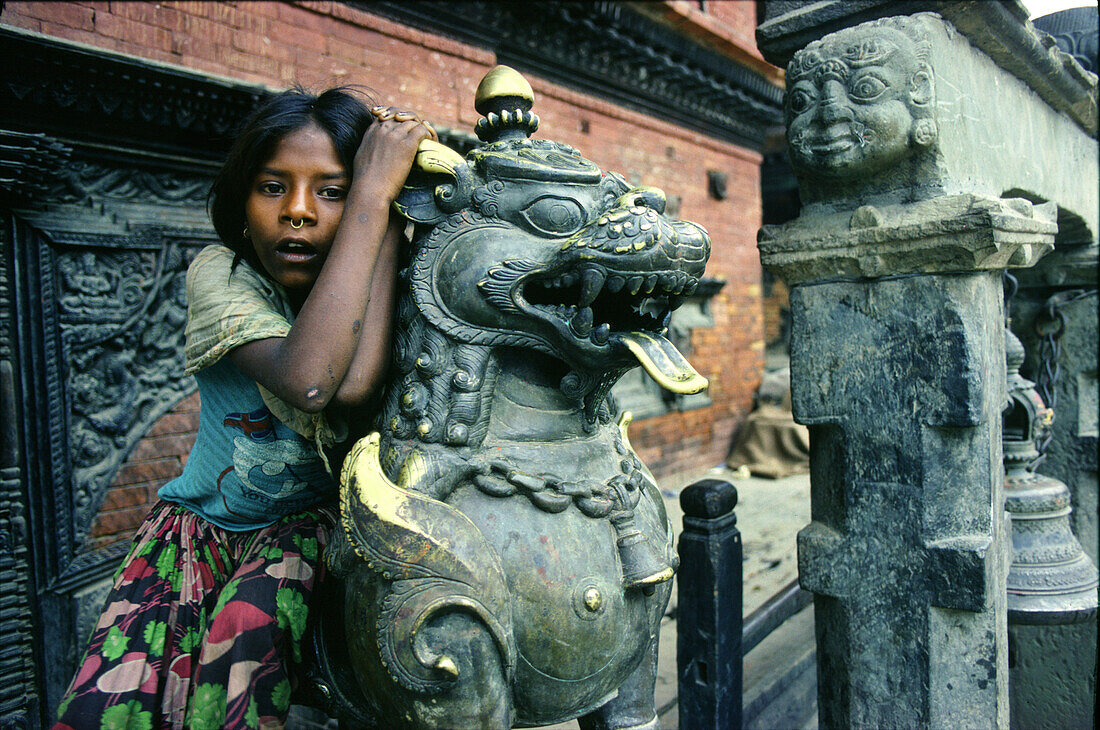 Girl in a Kathmandu temple, Kathmandu, Nepal Asia