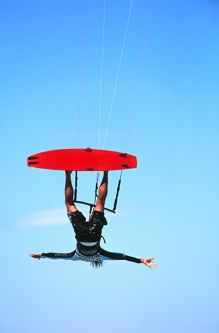 Man kiteboarding, big jump freehand