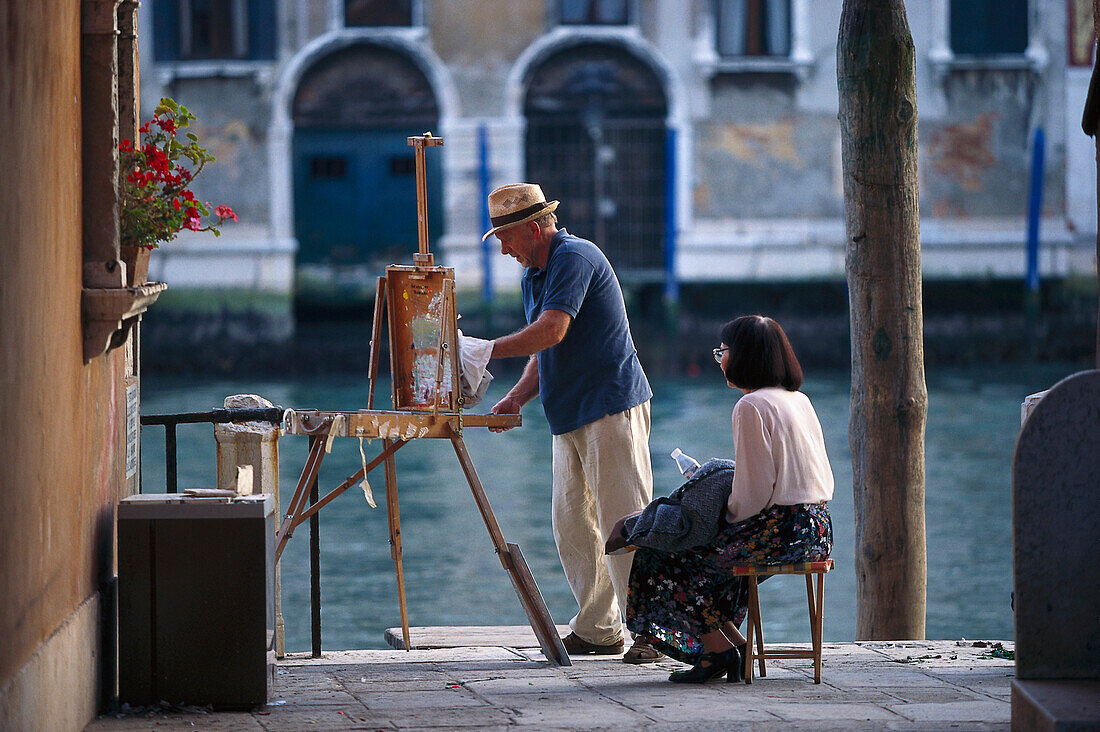 Painter and woman at Canale Grande, Venice, Veneto, Italy, Europe