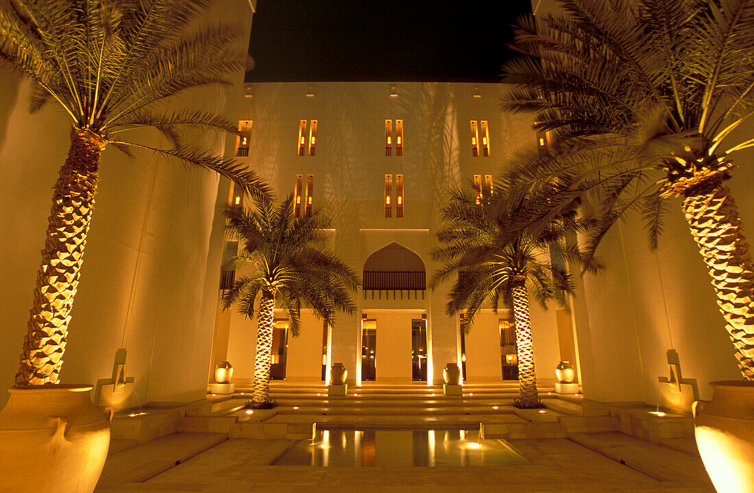 Illuminated atrium of the Chedi Hotel at night, Muscat, Oman