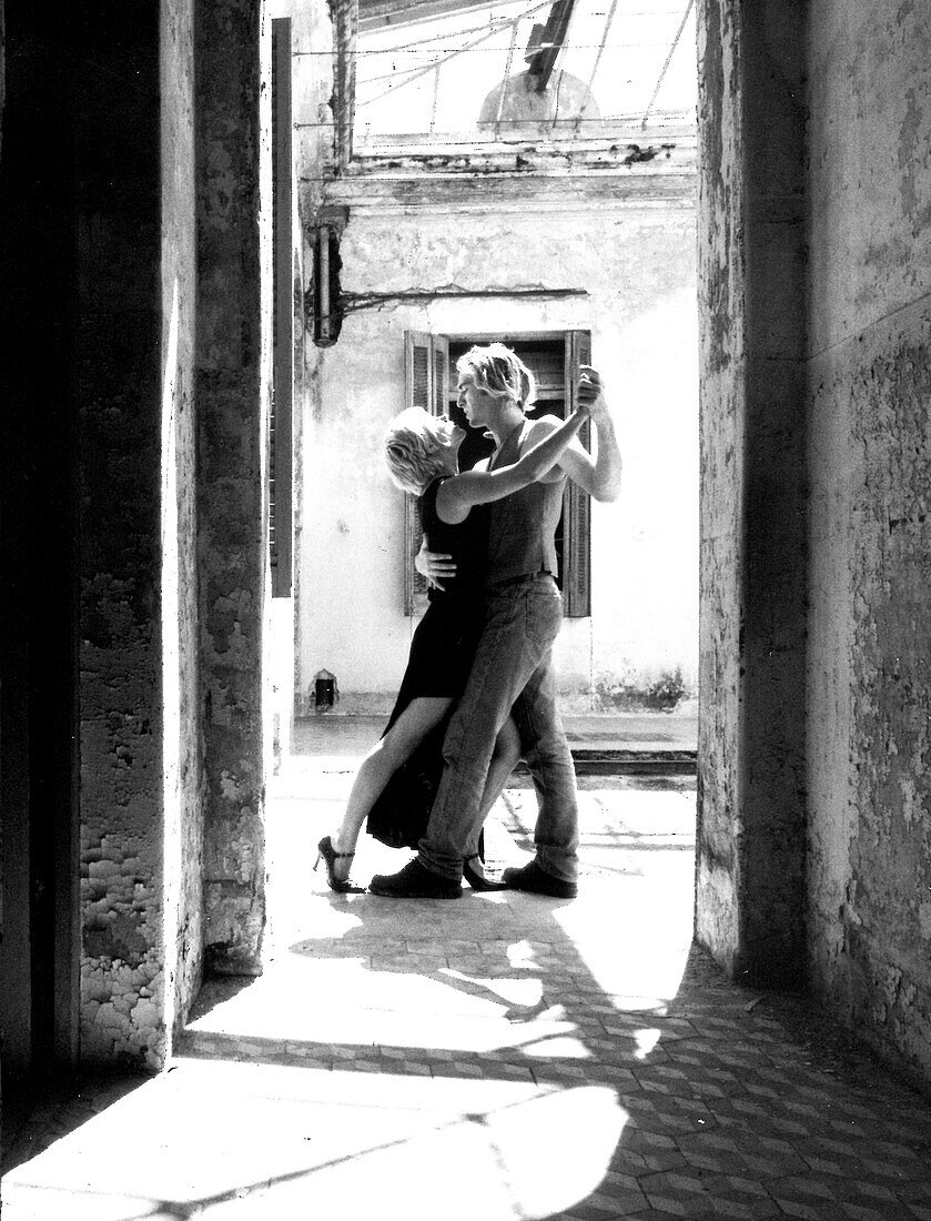Couple tangoing in a courtyard, Greece, Europe