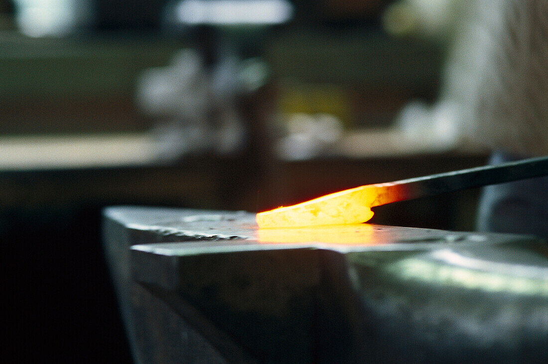 Red-hot iron on anvil