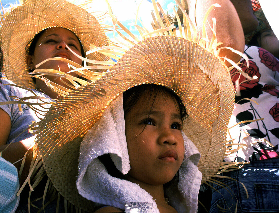 Girl watching Sinulog festival, Cebu City, Cebu Island Philippines