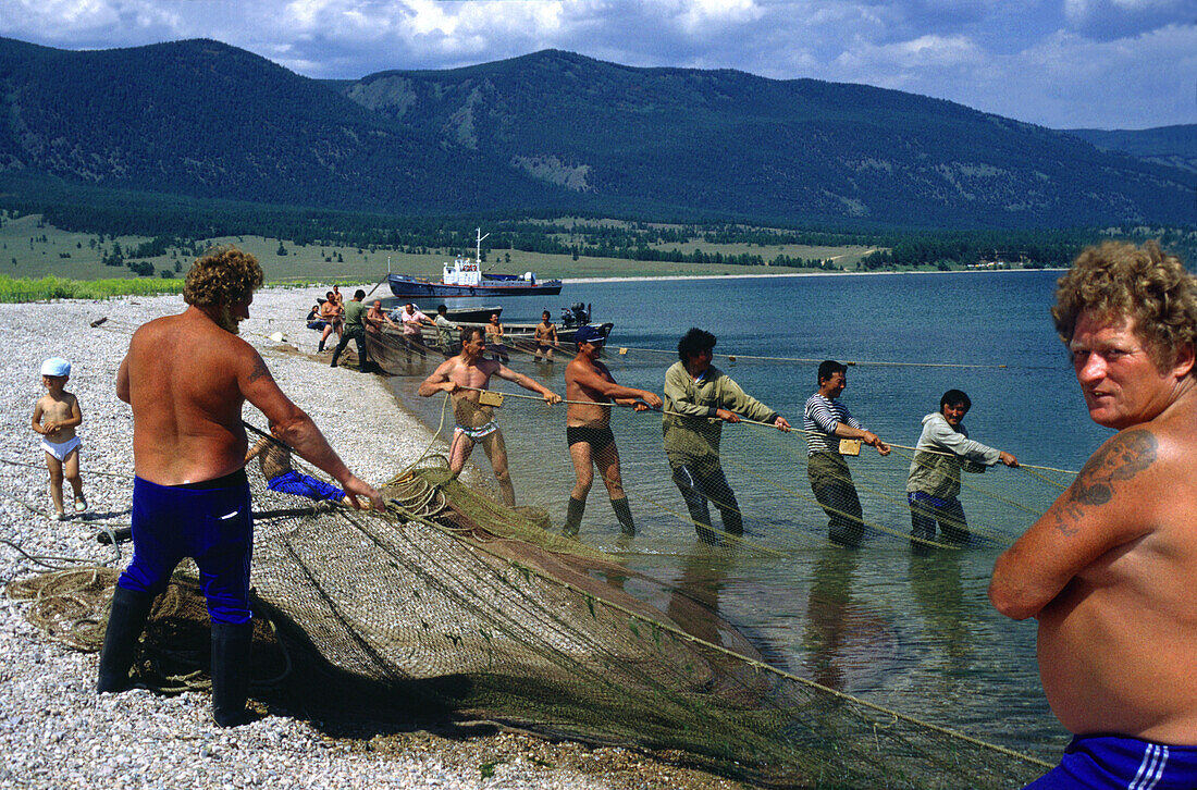 Fishermen pulling net, Lake Baikal, Siberia Russia