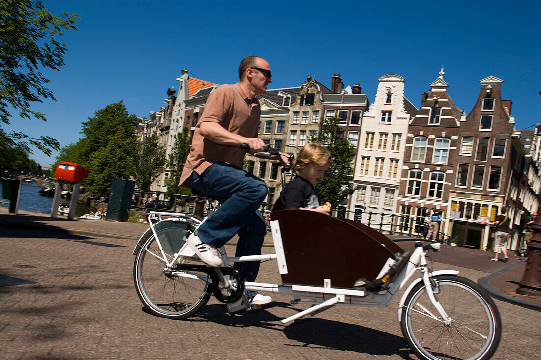 Cyclist, Keizersgracht, Father and sun cycling with a quaint Bicycle, Keizersgracht, Amsterdam, Holland, Netherlands