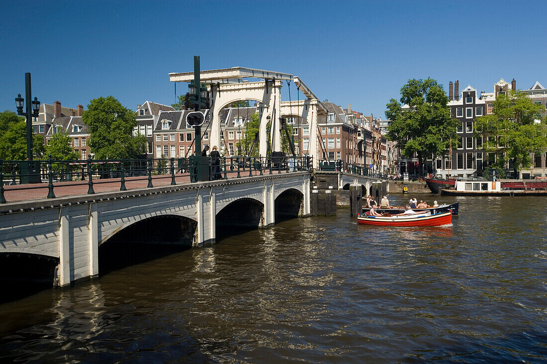 Leisure Boats, Magere Brug, Amstel, Leisure boats on Amstel on a sunny day, Magere Brug Skinny Bridge, in background, Amsterdam, Holland, Netherlands