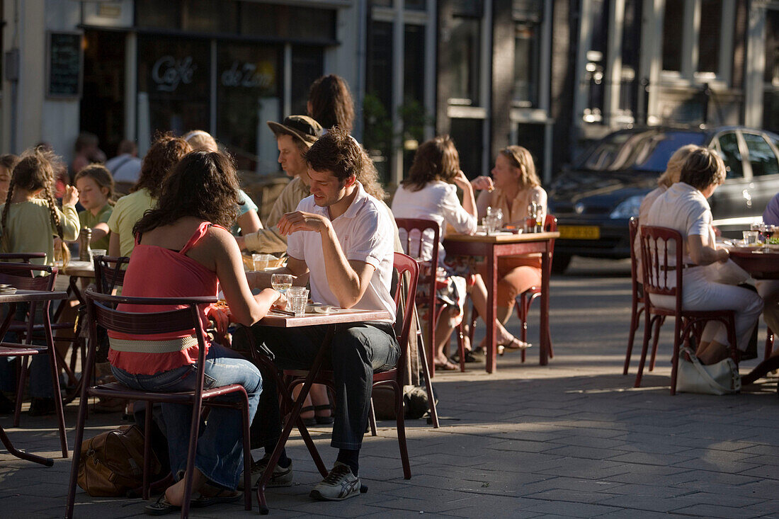 People, Provisional Open Air Restaurant, Jordaan, People sitting in a provisional open air restaurant on an extraordinary hot day, Lindengracht, Jordaan, Amsterdam, Holland, Netherlands. This special license is valid on days with over 30 degrees Celsius