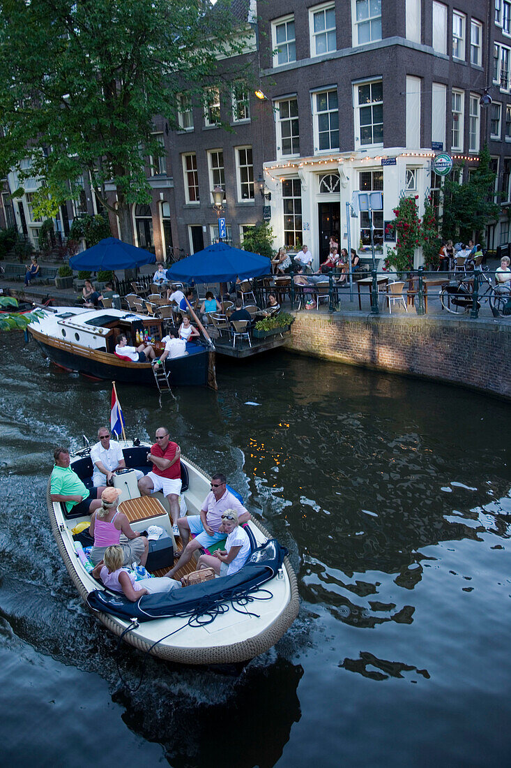 People, Boats, Cafe 't Smalle, Egelantiersgracht, Jordaan, People in leisure boat passing Cafe 't Smalle, Egelantiersgracht, Jordaan, Amsterdam, Holland, Netherlands