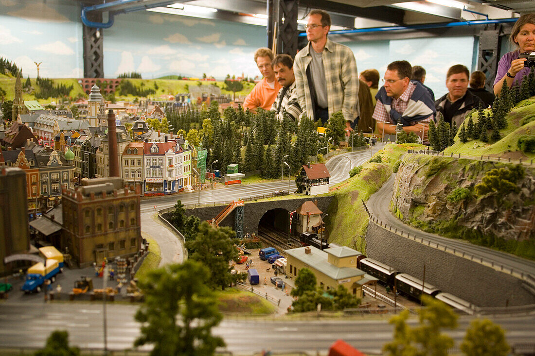 Visitors watching model railroad, the Miniatur Wunderland, Speicherstadt, Hamburg, Germany