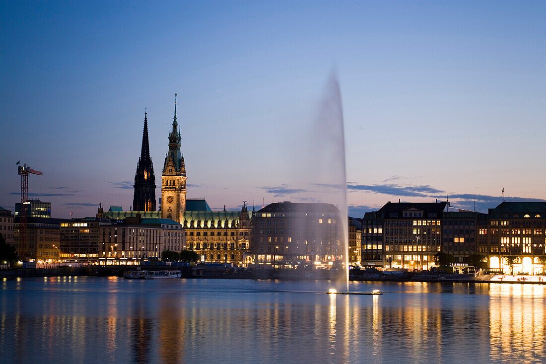 View over the Alster to the guildhall at dusk, Hamburg, Germany