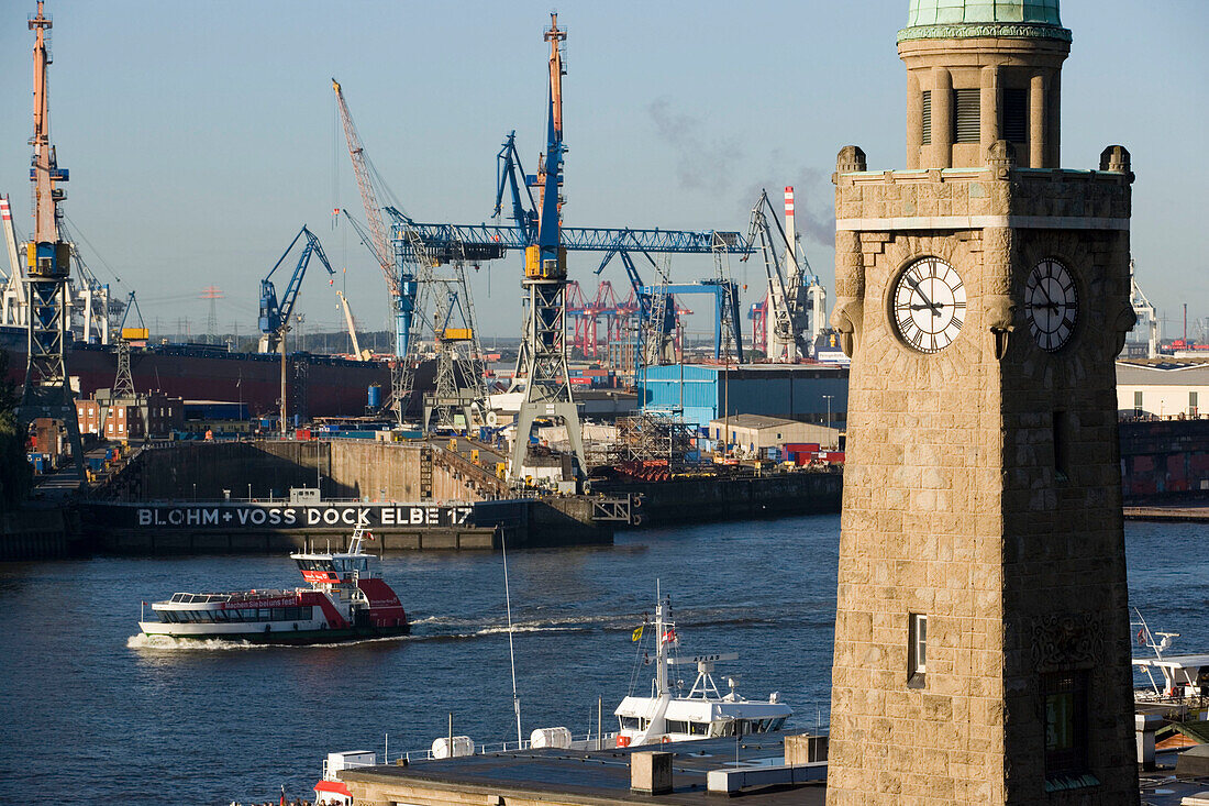 Tower and harbour with cranes in background, View over tower at Landungsbrücken to dockyardwith cranes, Sankt Pauli, Hamburg, Germany