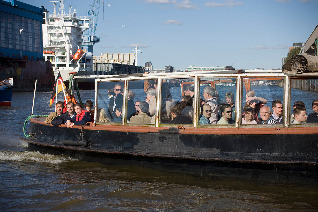 Harbour tour with a barge, People having a harbour tour with a barge at harbour, Hamburg, Germany