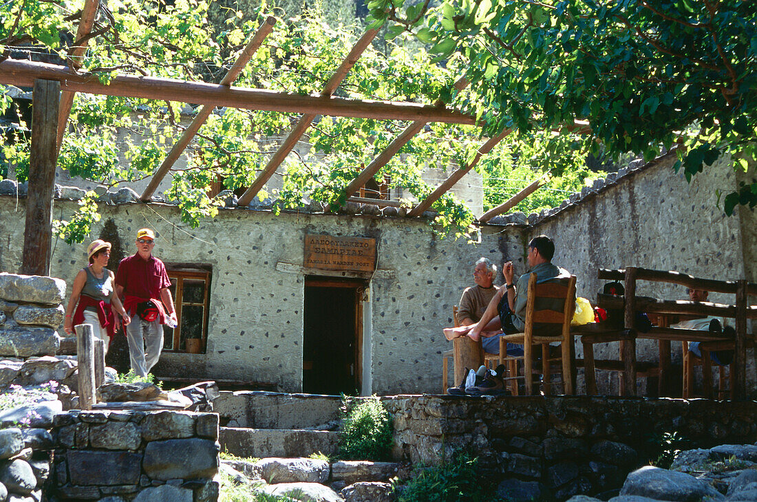 Hikers resting, Samaria Village, Samaria Gorge, Crete, Greece