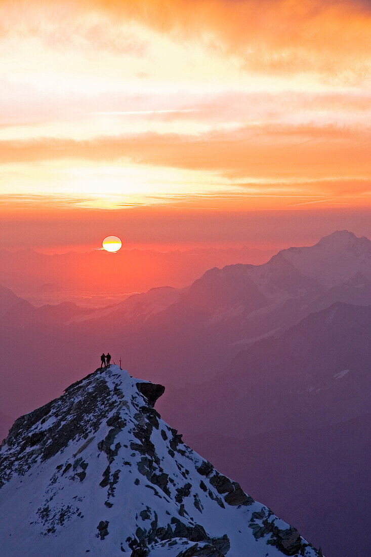 Two climbers on top of second summit of Bishorn at sunrise, Bishorn, 4135 meters, Valais, Wallis, Switzerland, Alps