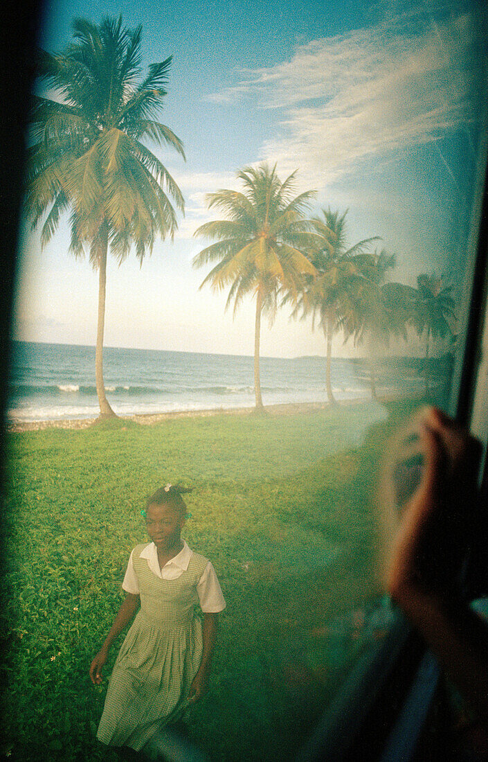 Schoolgirl seen through bus window, Jamaica, Caribbean