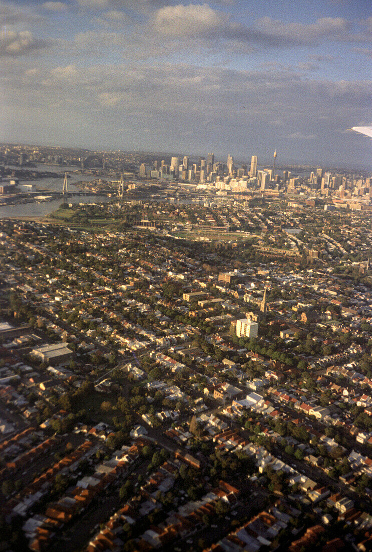 Aerial view of the city of Sydney under clouded sky, New South Wales, Australia