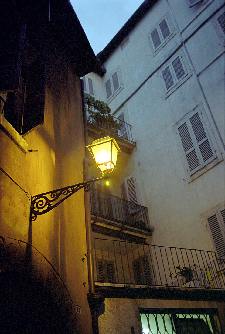 Lantern on house wall, Verona, Italy